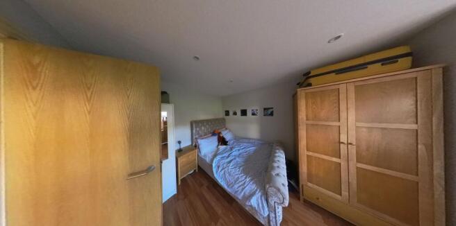 A spacious and well-maintained master bedroom f...