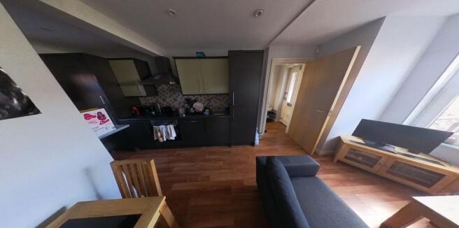 A spacious and well-lit modern living room feat...