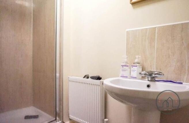 A clean and well-maintained bathroom with a sin...