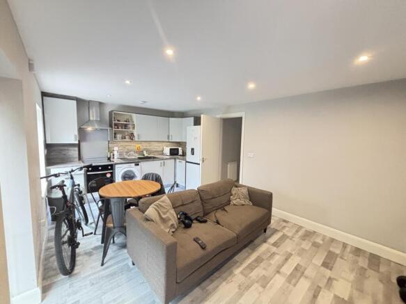 A bright and modern living room featuring a com...