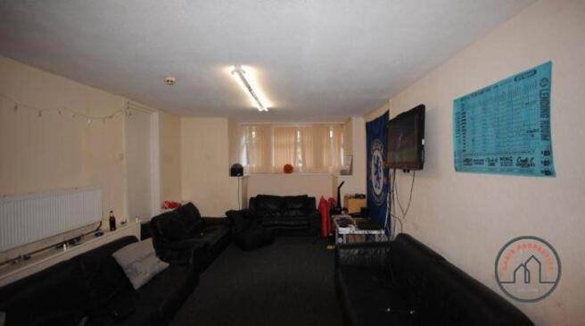 A spacious living room with comfortable seating...