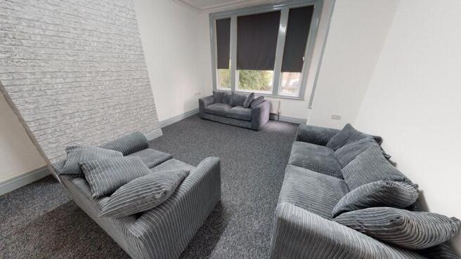 A spacious and modern living room with comforta...