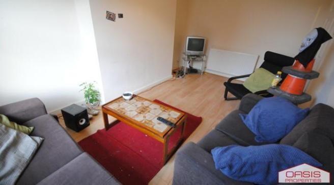 Bright and welcoming living room featuring comf...