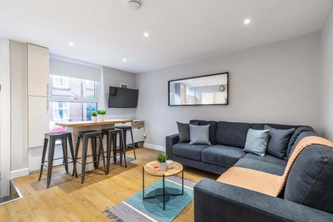 Bright, modern open-plan living area with a com...