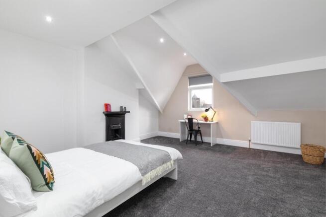 Bright, recently refreshed master bedroom in a ...