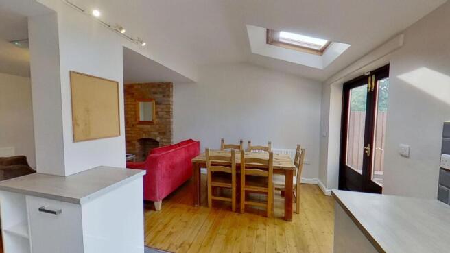 Bright open-plan living and dining area with wo...