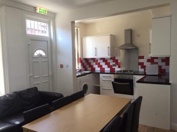 Bright open-plan living area with a modern kitc...