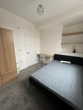 Bright, neatly presented double bedroom with a ...