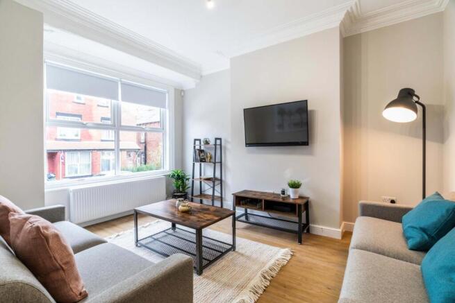 Bright, modern living room with a large front w...