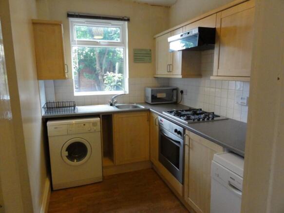Bright, functional kitchen with a large window ...