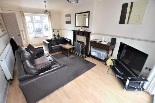 Bright, well-presented living room with large f...