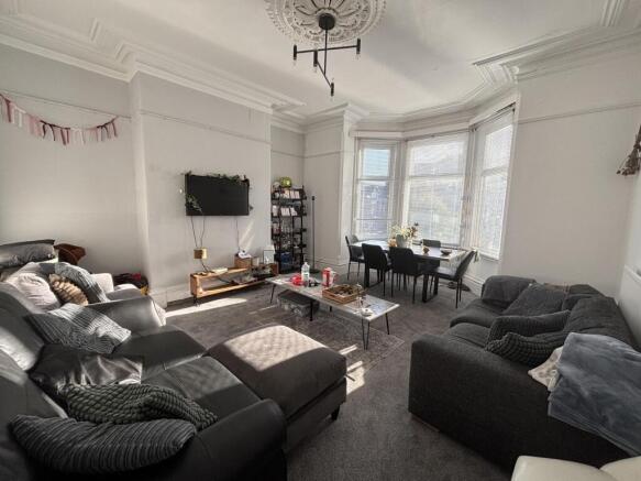 Bright, well-presented living room with large b...