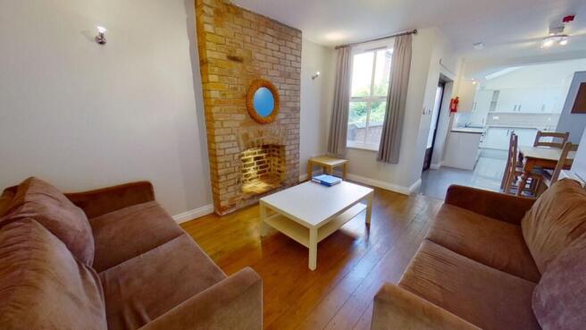 Bright, modern living room with two comfortable...