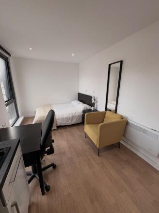 Bright, modern double bedroom with large window...