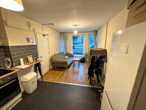 A cozy kitchenette with ample natural light, pe...