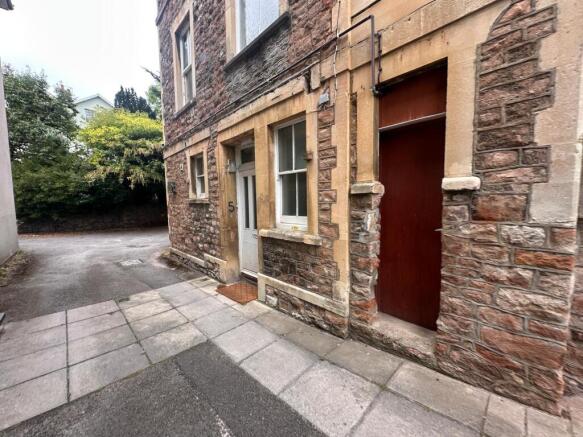 Stone-fronted property entrance set on a quiet ...