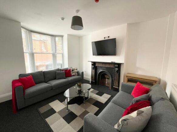 Bright, modern living room with two comfortable...