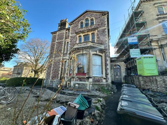 Historic stone-fronted property with decorative...