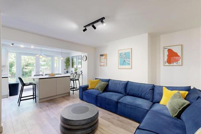 Bright and spacious living room featuring a lar...