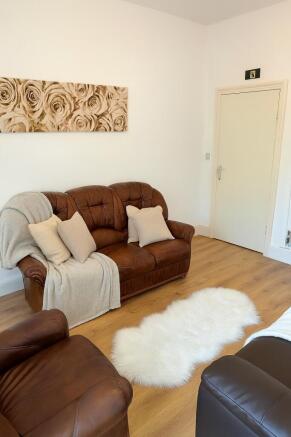 Bright, welcoming living room with comfortable ...