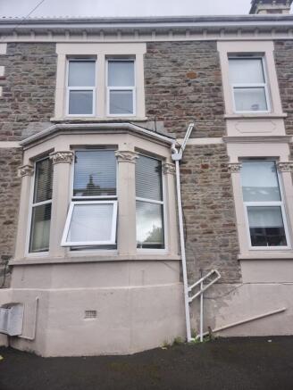 Classic stone-front terraced house with decorat...