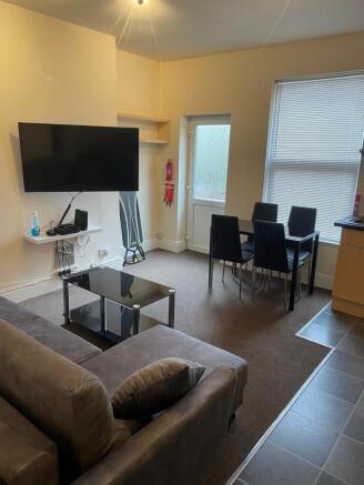 Bright, tidy open-plan living area with a comfo...