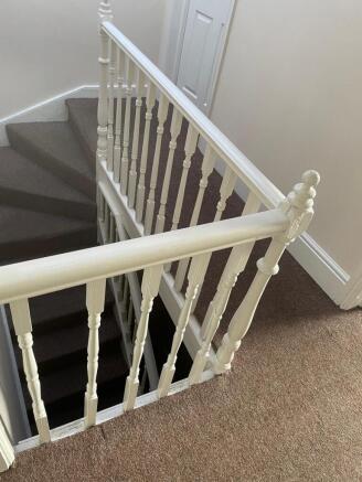 Well-maintained interior staircase with classic...