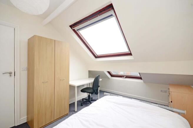 Bright attic double bedroom with large skylight...