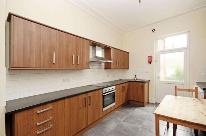 Bright modern kitchen with wood-effect cabinets...