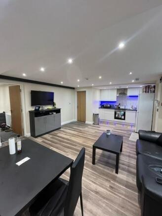 Bright open-plan living area with contemporary ...