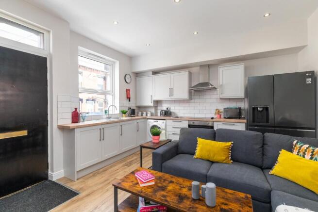 Bright open-plan living area with a modern fitt...