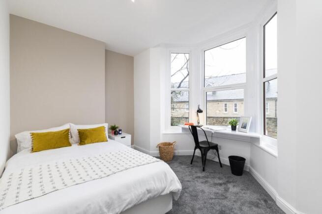 Bright, freshly decorated double bedroom with a...