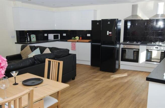 Bright open-plan living and kitchen with modern...