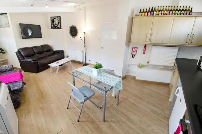 Bright, open-plan living area with a comfortabl...