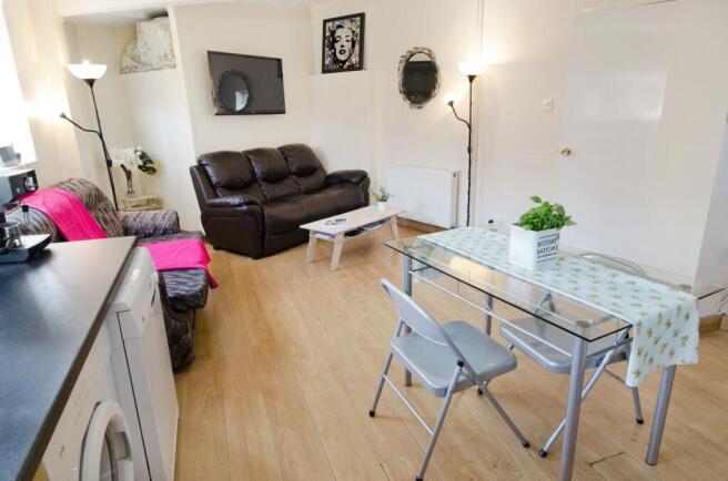 Bright, open living space with hardwood floors,...