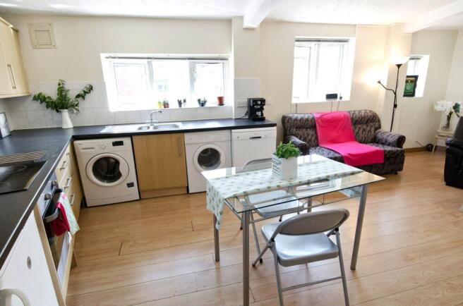 Bright open-plan kitchen and living area with a...