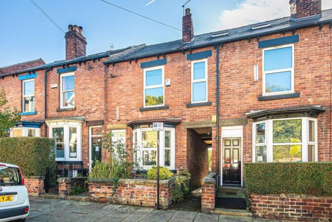 Charming red-brick terraced house with bay wind...