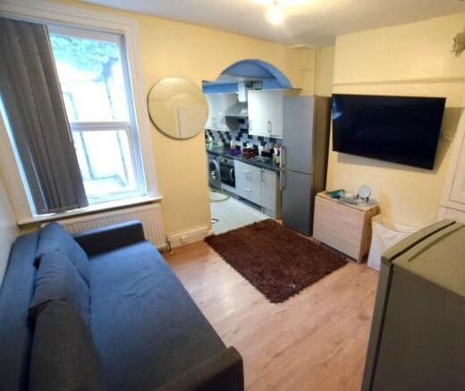 Bright, neatly presented living room opening in...