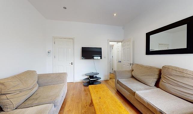 Bright, contemporary living room with hardwood ...