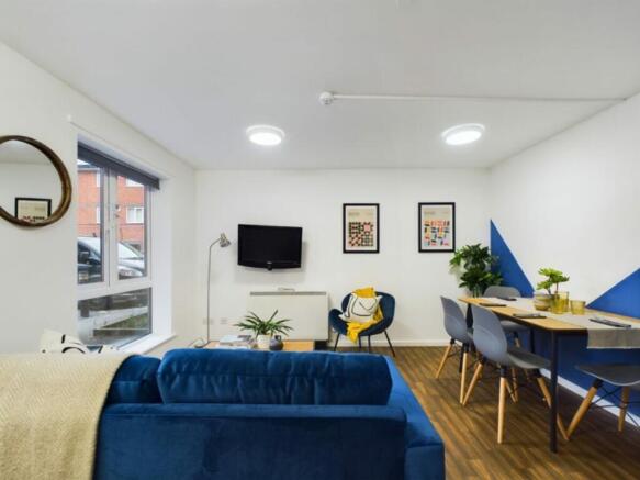 A spacious and inviting modern living room, per...