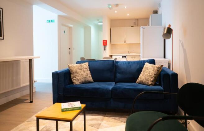 A spacious and inviting modern living room, per...