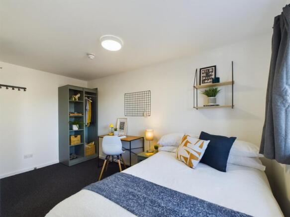 A stylish and inviting double bedroom featuring...