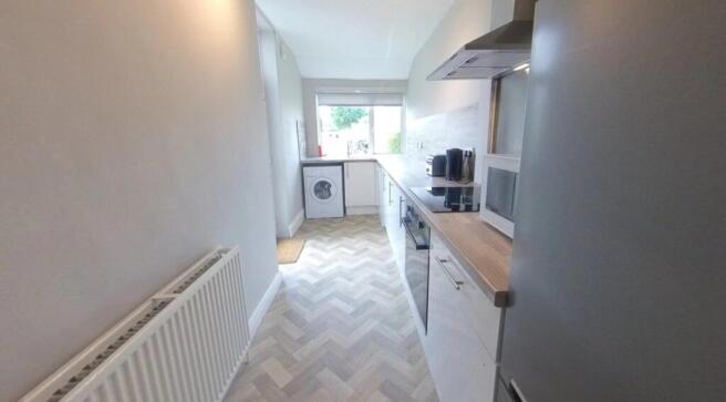Bright, modern galley kitchen with fitted units...