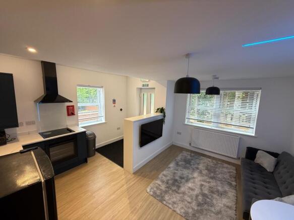 Bright open-plan living area with a modern kitc...