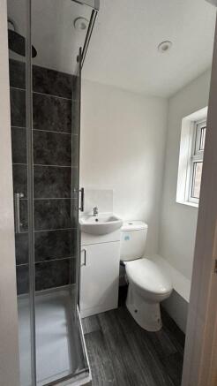 Bright and modern bathroom featuring a sleek sh...