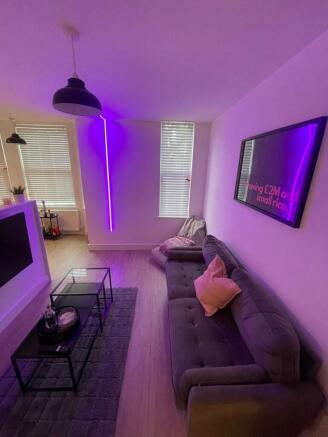 Contemporary living room with a comfy dark grey...