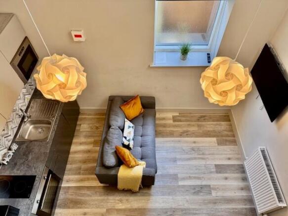 Bright, modern open-plan living area with styli...