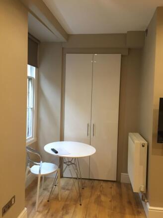 Bright, neatly presented kitchenette/dining cor...