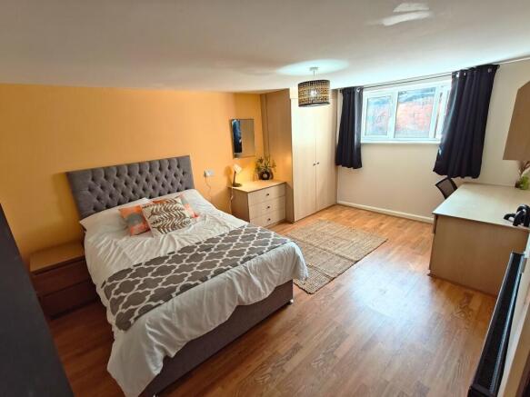 Bright, well-presented bedroom with a comfortab...