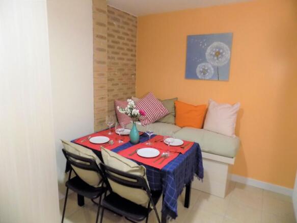 Bright, cosy communal lounge corner with a cush...